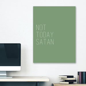 Green minimalist canvas wrap wall art hanging on white bedroom wall with funny saying "not today satan"