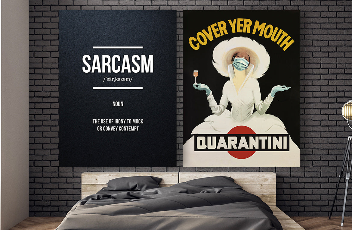 Bedroom with two large funny canvas wrap wall art pieces hanging above bed. Sarcasm definition and Quarantini parody art pieces are hung on dark wall next to bedroom lamp.