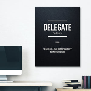 Funny wall art with the definition of "delegate", poster is hung on dorm wall