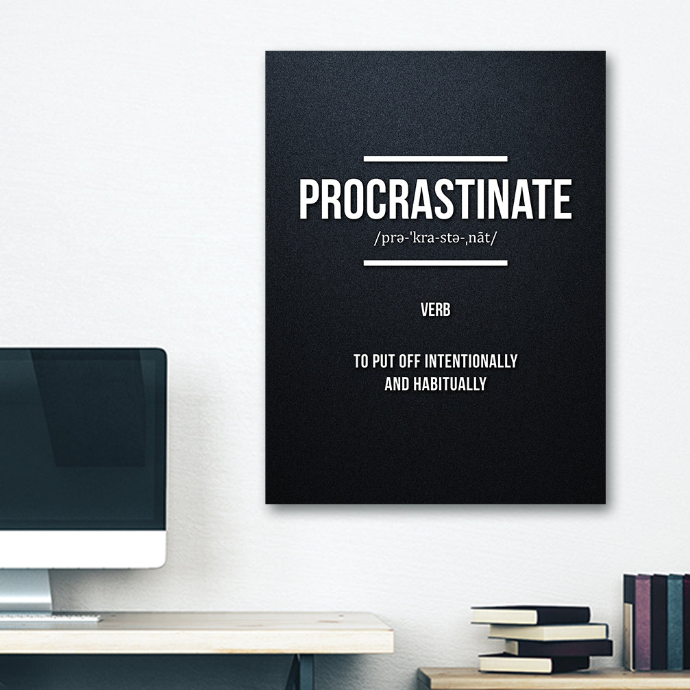 Funny wall art with the definition of "procrastinate", poster is hung on dorm wall