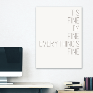 White minimalist canvas wrap wall art hanging on white bedroom wall with funny saying "It's fine"